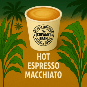 Hot Espresso Macchiato in branded to-go cup with tropical background