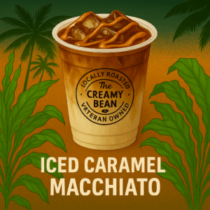 Iced Caramel Macchiato in a clear cup with caramel drizzle and The Creamy Bean logo