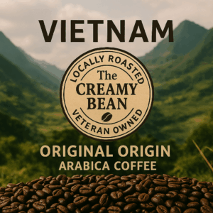 "Vietnamese coffee beans in a white to-go cup with The Creamy Bean logo, set against a tropical background with warm tones"